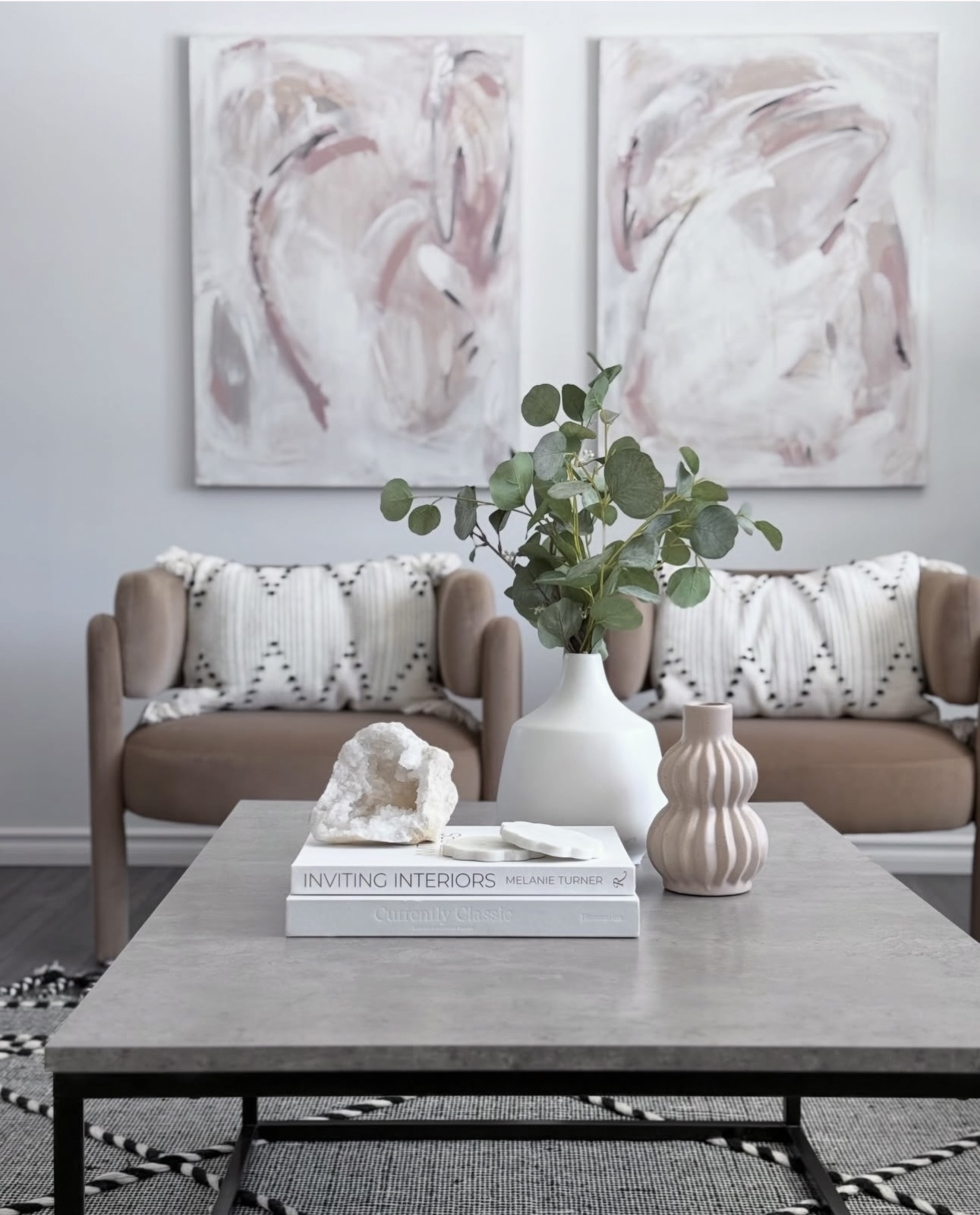 Living room staged by Aimee Lauren Interiors with soft abstract artwork above the sofa